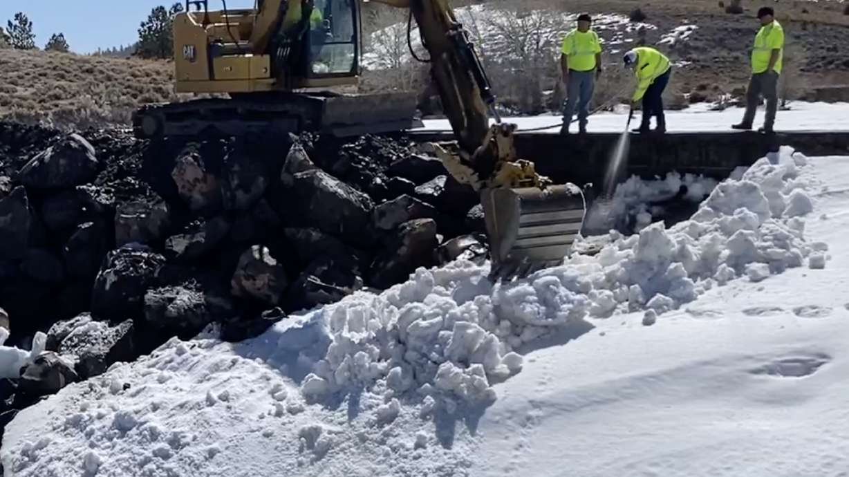 Crews work to make repairs to the Panguitch Lake dam in Garfield County on Thursday. Public safety officials say they are still "encouraged" by progress to protect the dam from any breaches.