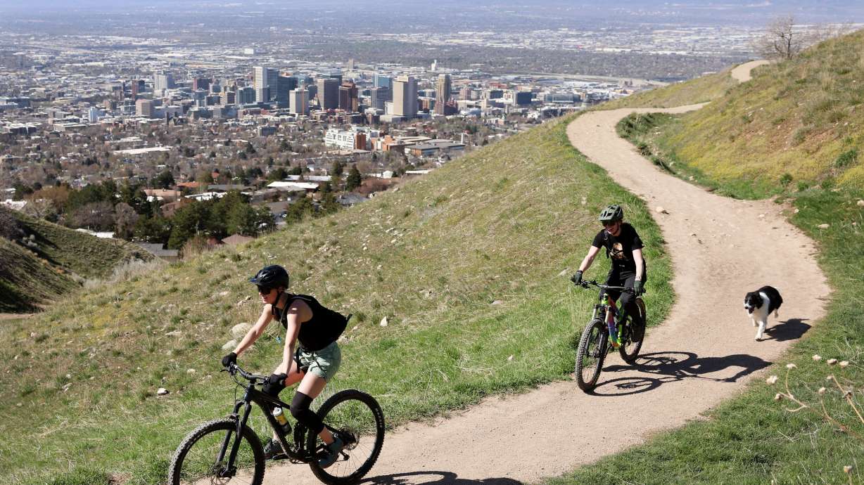 Mountain bikers ride along the Bonneville Shoreline trail in Salt Lake City on Thursday.