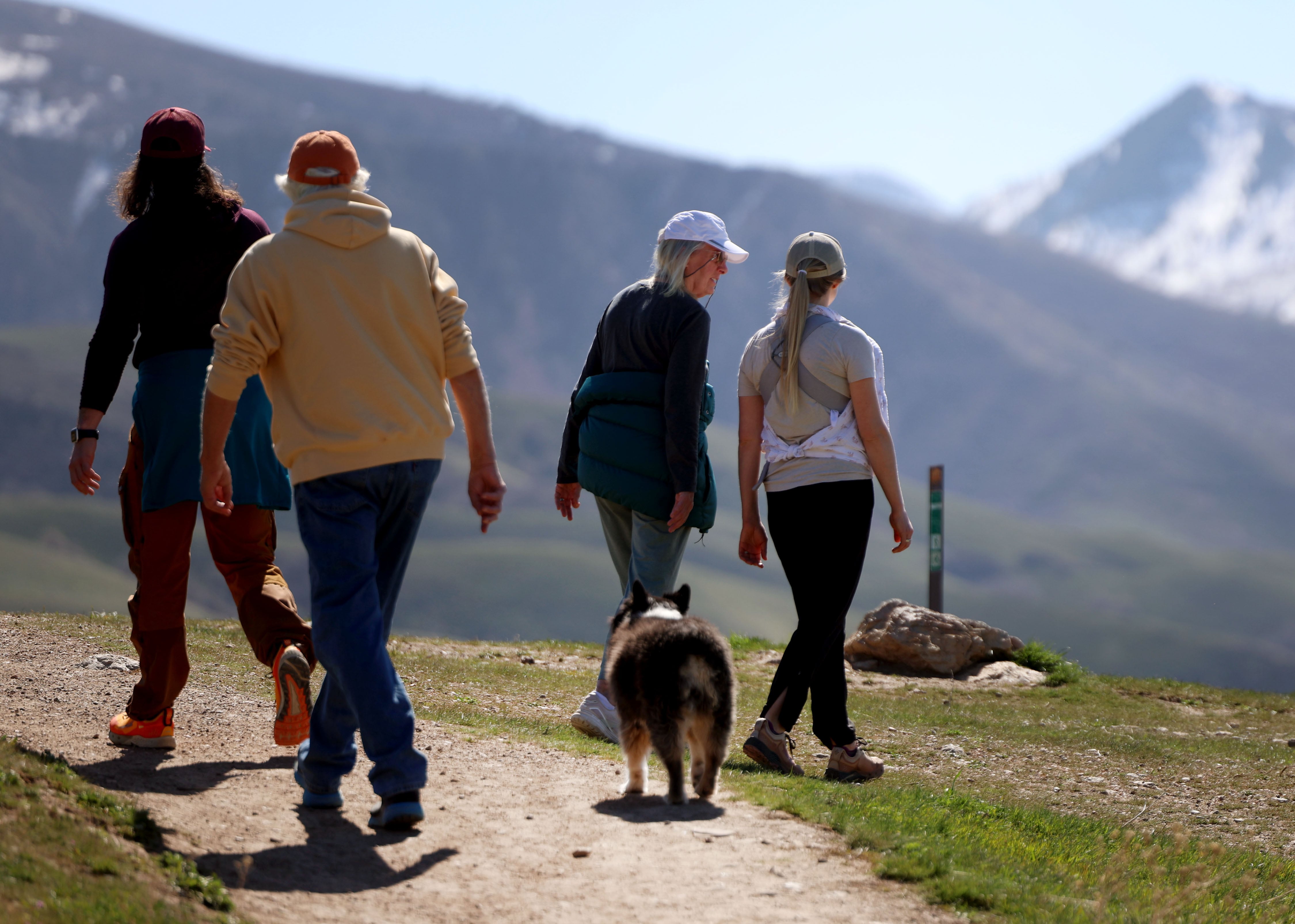 People walk on the Bonneville Shoreline trail in Salt Lake City on Thursday.