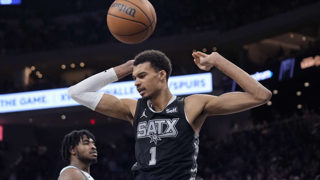 San Antonio Spurs center Victor Wembanyama (1) scores against the Brooklyn Nets during the second half of an NBA basketball game in Austin, Texas, Sunday, March 17, 2024.