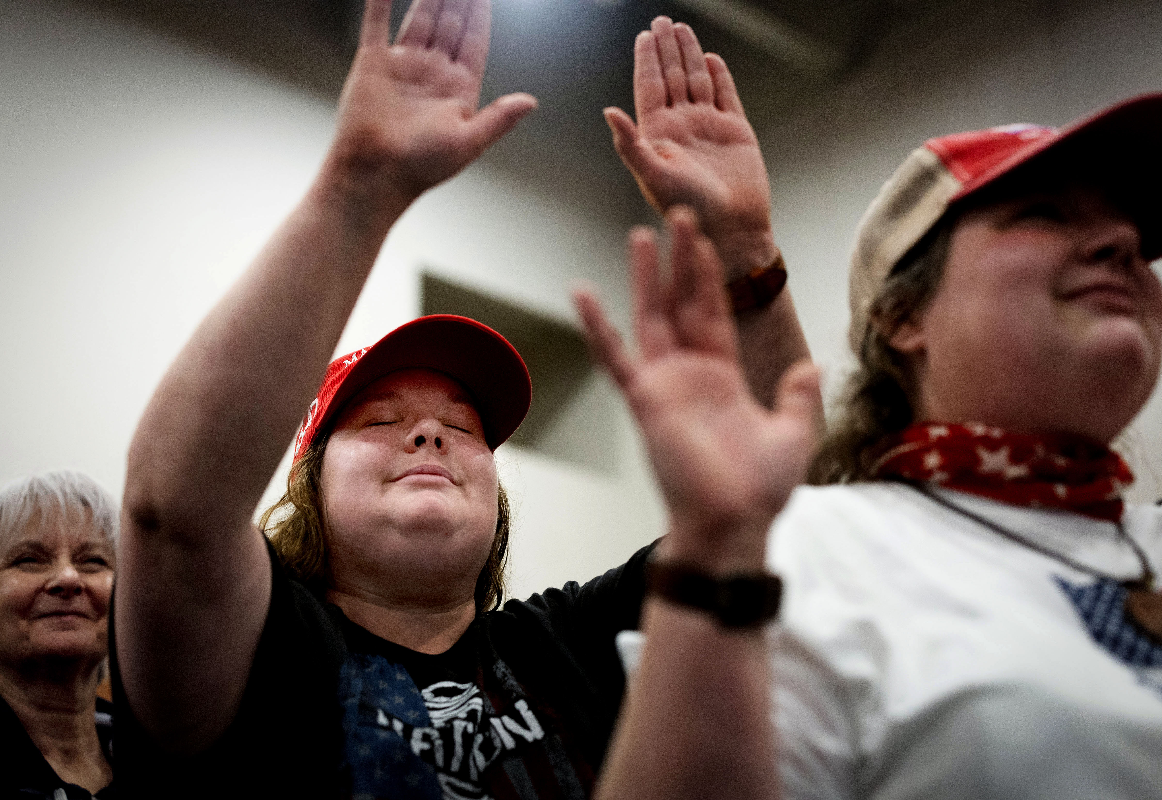 Misty Grace of Green Bay, Wis., who describes herself as a follower of Jesus Christ, prays during a rally for former President Donald Trump at the KI Convention Center in Green Bay, Wis., on April 2.