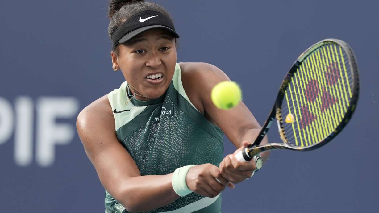 Naomi Osaka, of Japan, hits a return to Caroline Garcia, of France, during the Miami Open tennis tournament, Sunday, March 24, 2024, in Miami Gardens, Fla.