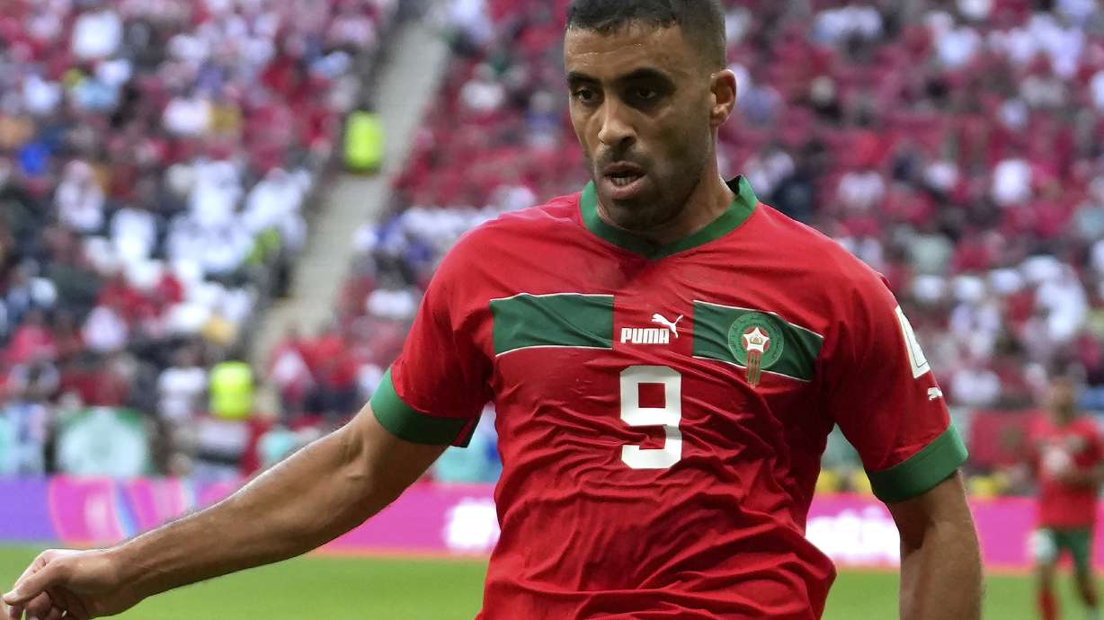 FILE -Morocco's Abderrazak Hamdallah in action during the World Cup group F soccer match between Morocco and Croatia, at the Al Bayt Stadium in Al Khor, Qatar, Wednesday, Nov. 23, 2022. A fan at the Saudi Super Cup final lashed an Al-Ittihad player with a whip during a confrontation moments after the match Thursday night.
