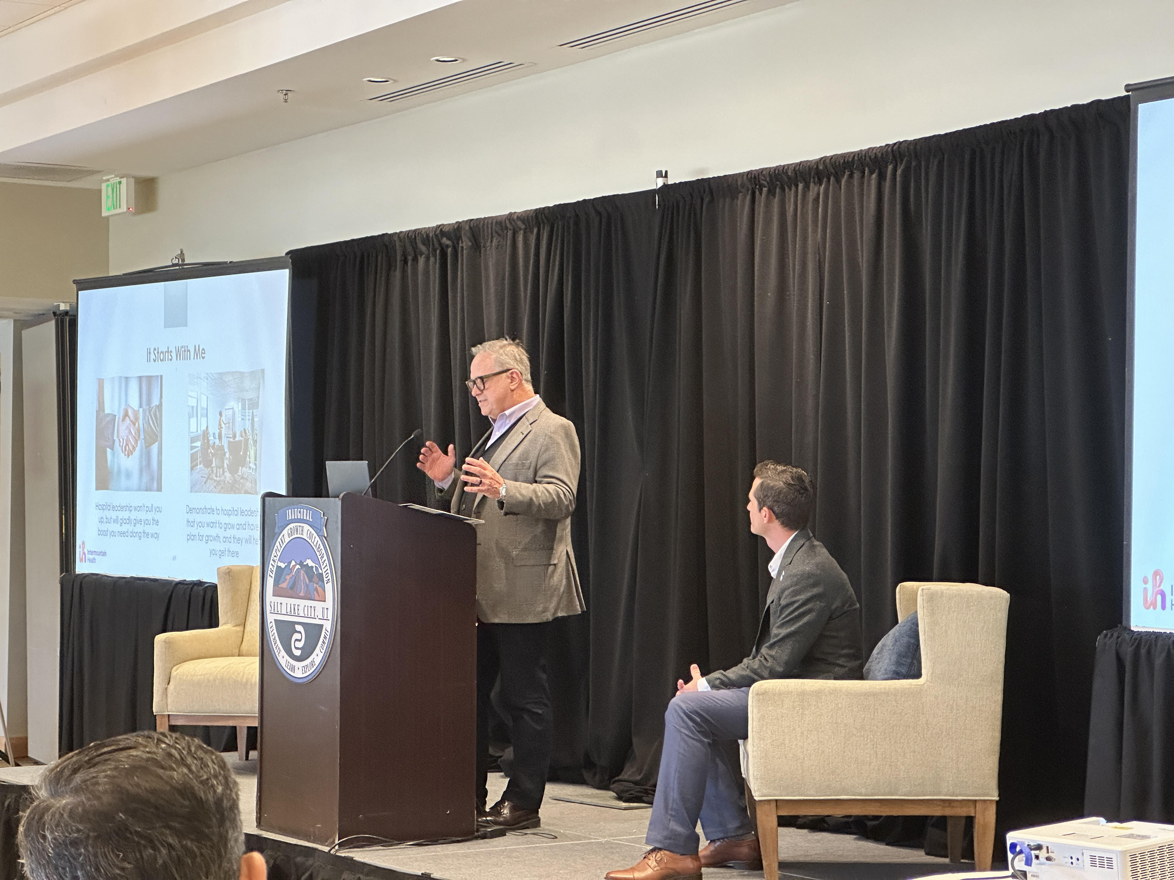 Dr. Jean Botha and Derek Ginos, from Intermountain Health, speak at the Transplant Growth Collaboration on Friday at the Cottonwood Country Club.