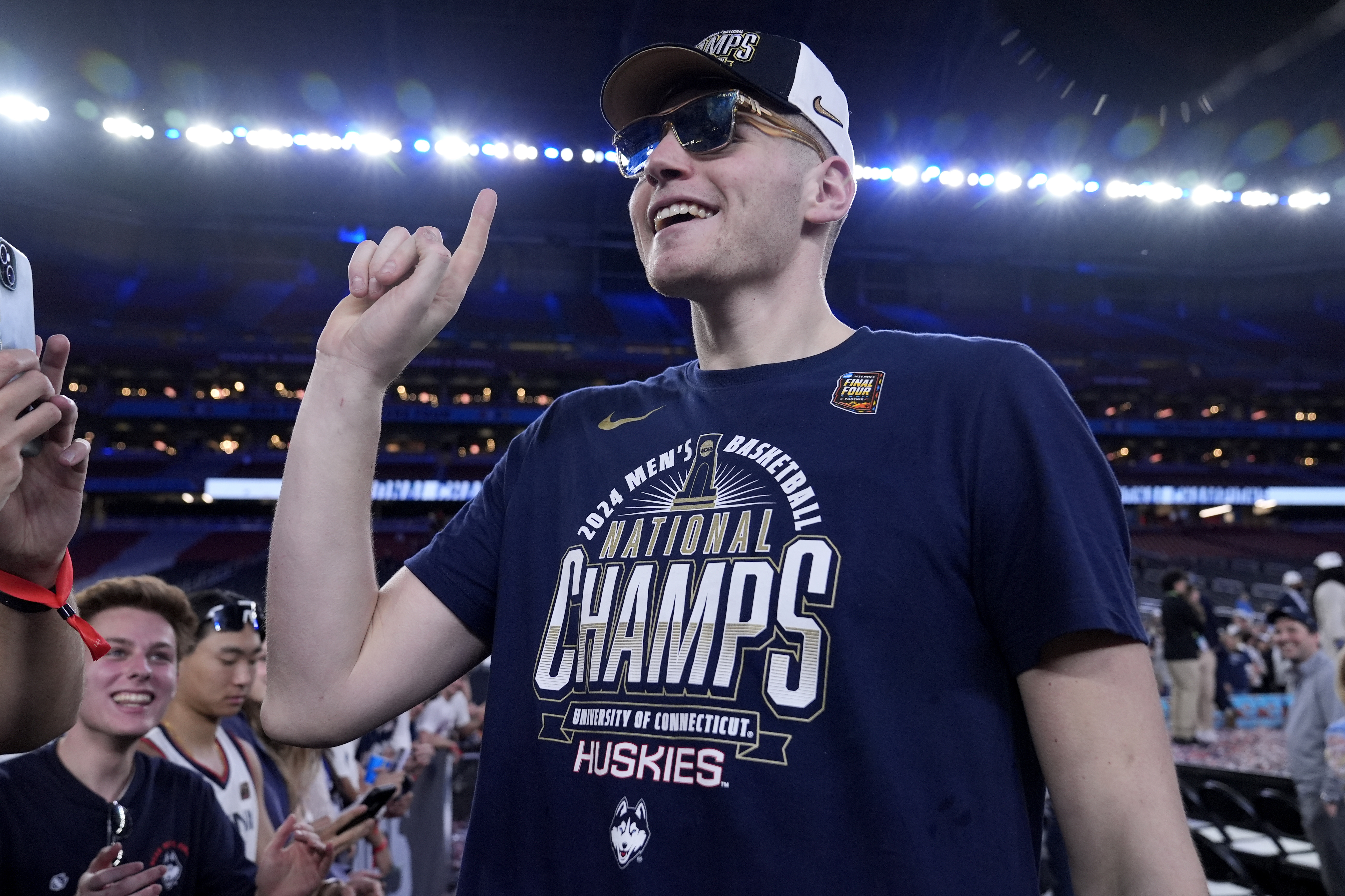 UConn center Donovan Clingan celebrates after the NCAA college Final Four championship basketball game against Purdue, Monday, April 8, 2024, in Glendale, Ariz.