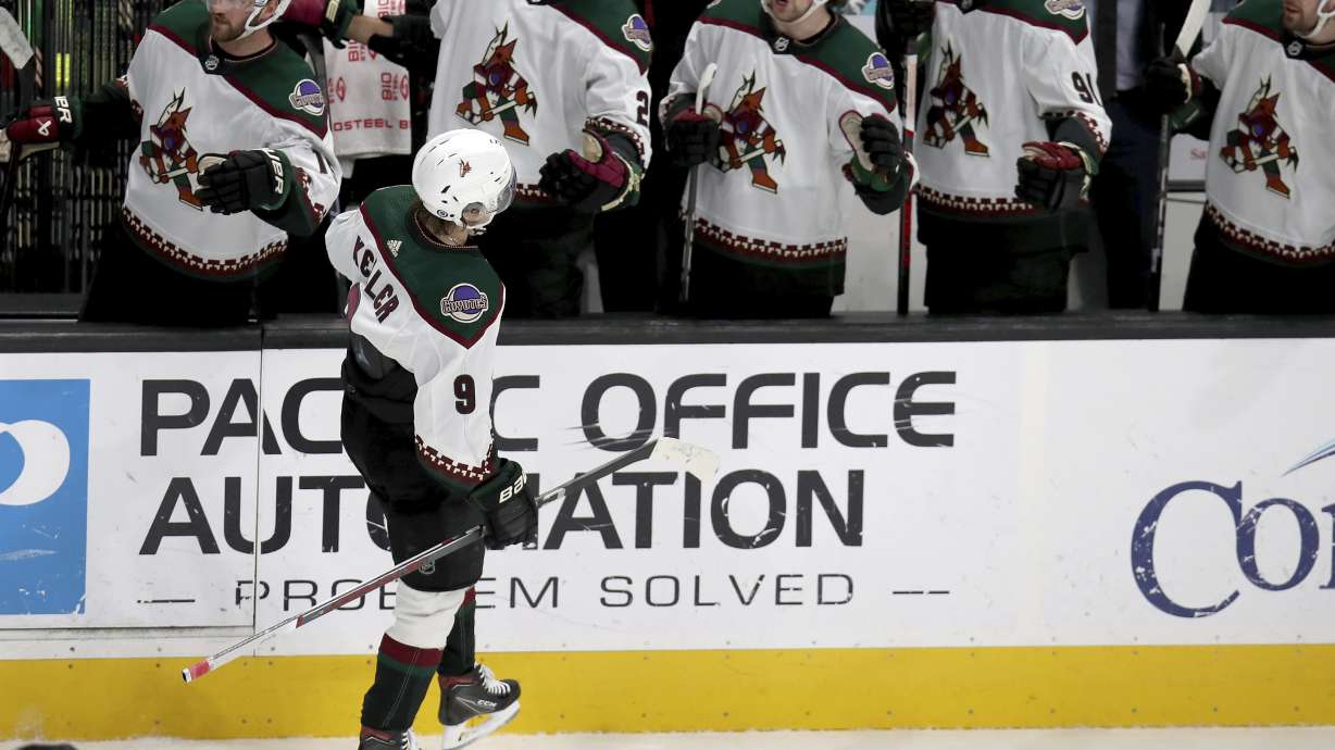 Arizona Coyotes right wing Clayton Keller (9) celebrates with the team bench after a goal in an NHL hockey game against the San Jose Sharks in San Jose, Calif., Sunday, April 7, 2024.