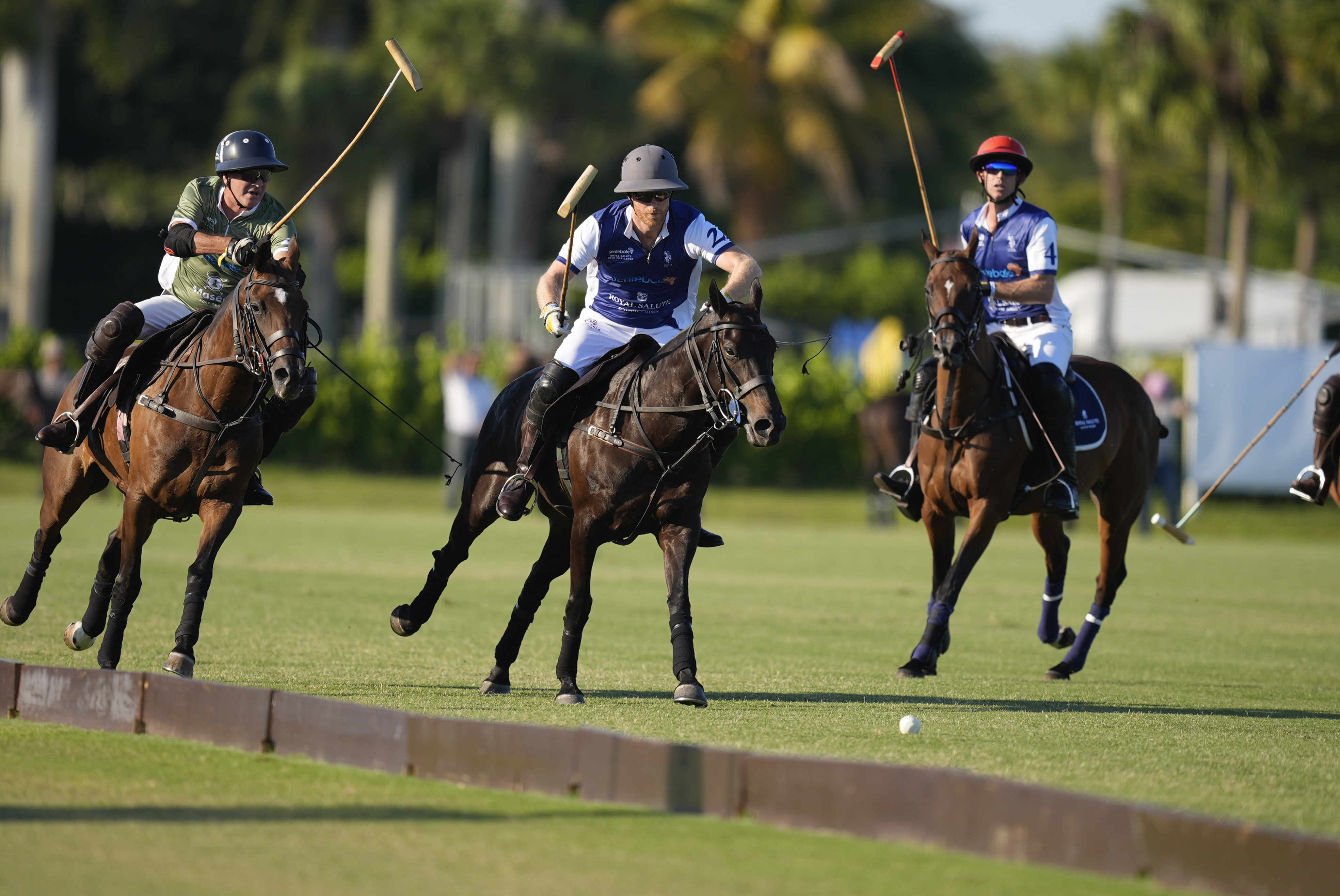 Britain's Prince Harry, center, races for a ball as he plays in the 2024 Royal Salute Polo Challenge to Benefit Sentebale, Friday, April 12, 2024, in Wellington, Fla. Prince Harry, co-founding patron of the Sentebale charity, will play on the Royal Salute Sentebale Team. 