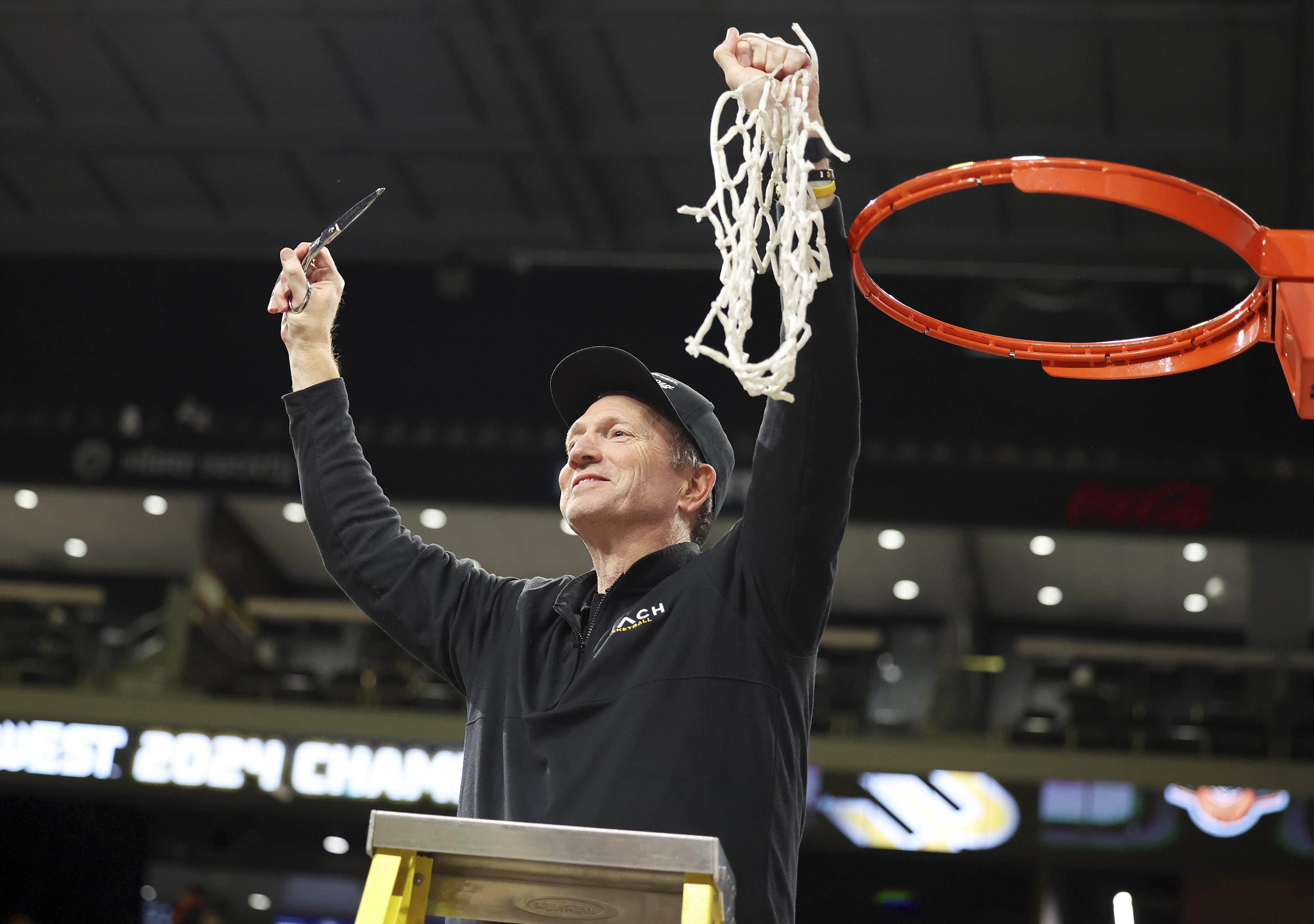 Long Beach State head coach Dan Monson participates in a net cutting ceremony after his team played an NCAA college basketball game against UC Davis in the championship of the Big West Conference men's tournament Saturday, March 16, 2024, in Henderson, Nev. Long Beach State won 74-70. 