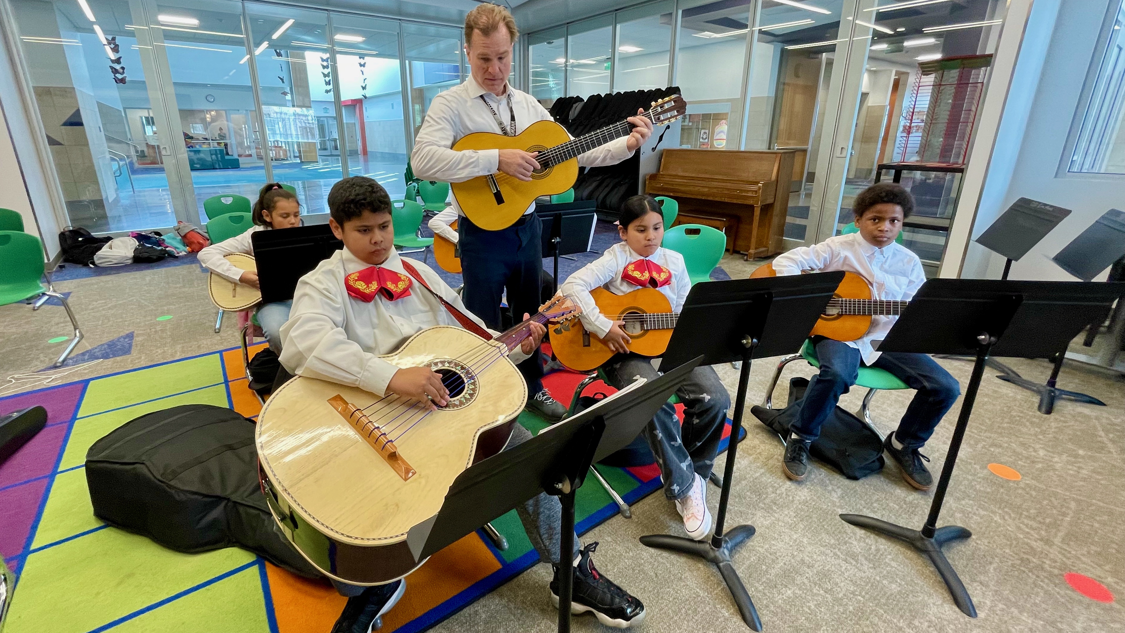 Ogden School District music instructor Adam Kozlewski instructs the members of the after-school mariachi group at East Ridge Elementary on Tuesday.