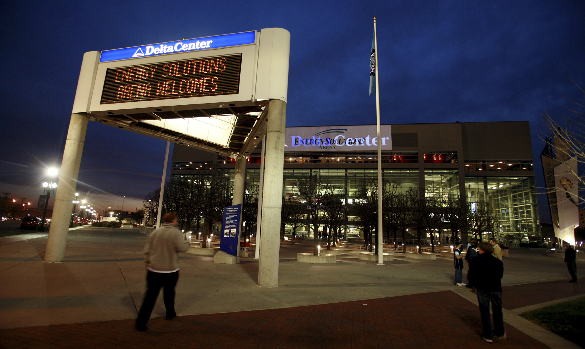 FILE - The marquee in front of the Energy Solutions Arena, formerly the Delta Center, home of the Utah Jazz, shows conflicting signage at dusk before a game against the Toronto Raptors, Monday, Nov. 20, 2006, in Salt Lake City. Preparations are being made in case an NHL team is in Salt Lake City sooner than later. Prospective owner Ryan Smith earlier this week solicited public suggestions for a team name. All this comes as the Arizona Coyotes are hoping to win a land auction for a site to build a new arena in the city of Phoenix. 