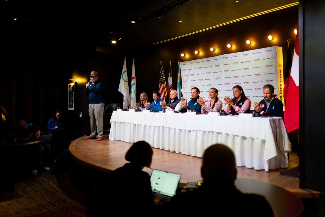 Members of the International Olympic Committee’s Future Host Commission, IOC and U.S. Olympic & Paralympic leaders applaud during a press conference Saturday during their visit to Salt Lake City to tour proposed venues for the 2034 Games at Edison House.