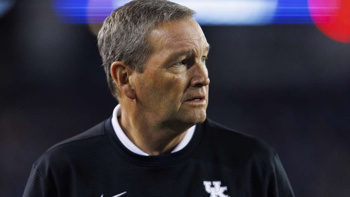 FILE - University of Kentucky Director of Athletics Mitch Barnhart watches an NCAA college football game between Kentucky and Mississippi State in Lexington, Ky., Oct. 15, 2022. Two former Kentucky swim team members have sued the school, former coach Lars Jorgensen and athletic director Mitch Barnhart, alleging sexual assaults including rape by the former coach and claiming the school “purposefully” disregarded multiple credible reports of inappropriate sexual relationships.