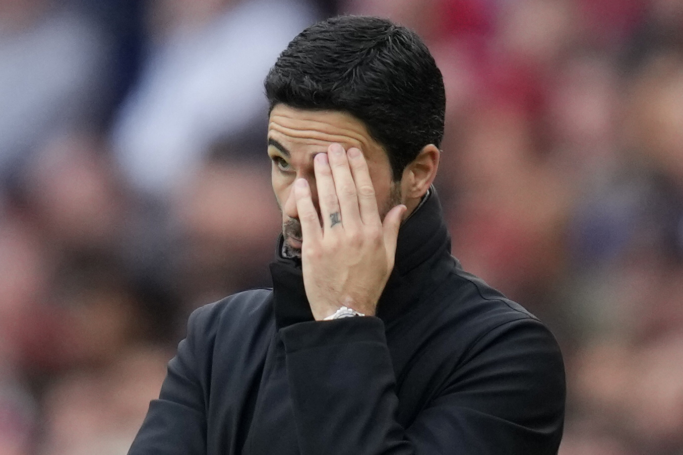 Arsenal's manager Mikel Arteta reacts during the English Premier League soccer match between Arsenal and Aston Villa at the Emirates stadium in London, Sunday, April 14, 2024.