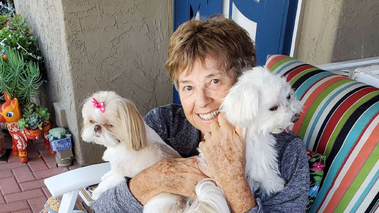 Hope Murray sits with some furry friends in San Diego, California. Murray retired in 2013 after a 50-year career that ranged from game show producer to Hollywood party planner to casino executive.