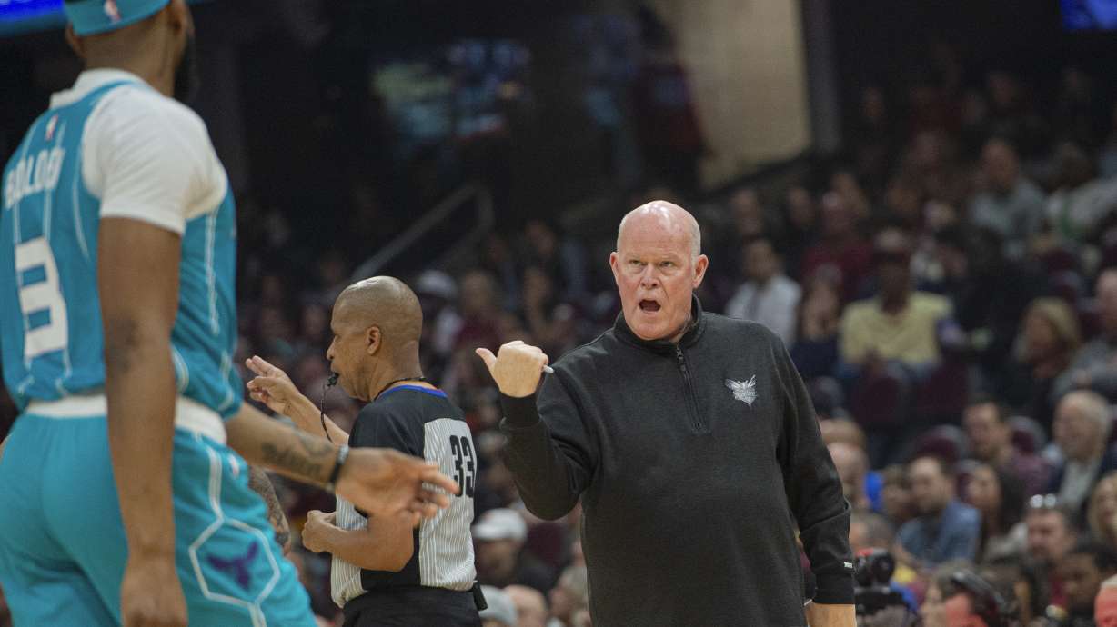 Charlotte Hornets head coach Steve Clifford, right, talks with Marques Bolden (3) during the first half of an NBA basketball game against the Cleveland Cavaliers in Cleveland, Sunday, April 14, 2024.
