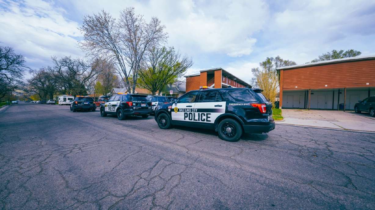 Salt Lake police officers investigate a shooting near 200 East and Kensington Avenue in Salt Lake City on Sunday. Officers were unable to locate a victim, but recovered a gun in a nearby neighbor's yard.