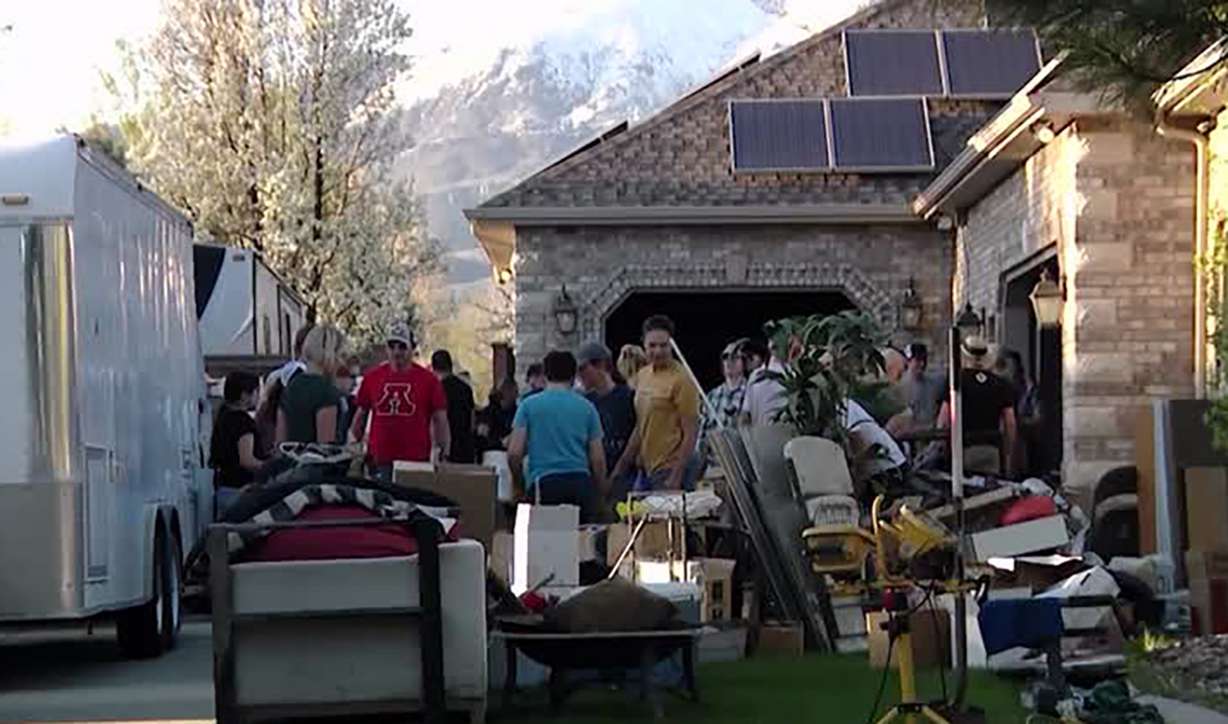 Neighbors help after a pipe burst in a Highland neighborhood Saturday, causing a flood and damaging two homes.