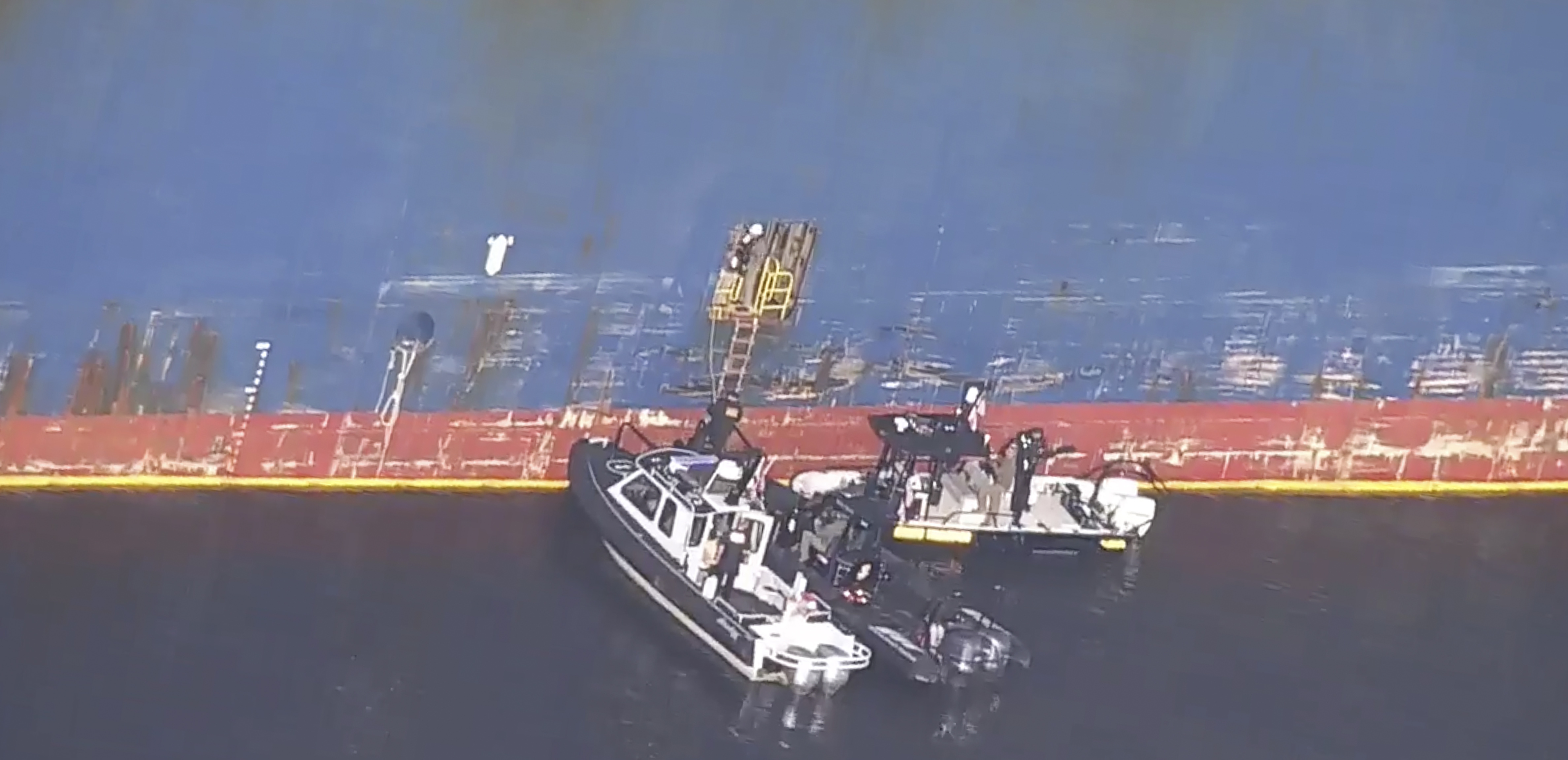 FBI agents get on board the cargo ship Dali on Monday in Baltimore.