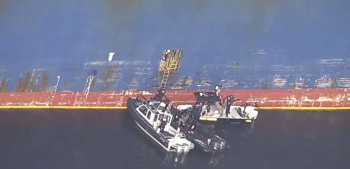 FBI agents get on board the cargo ship Dali on Monday in Baltimore.