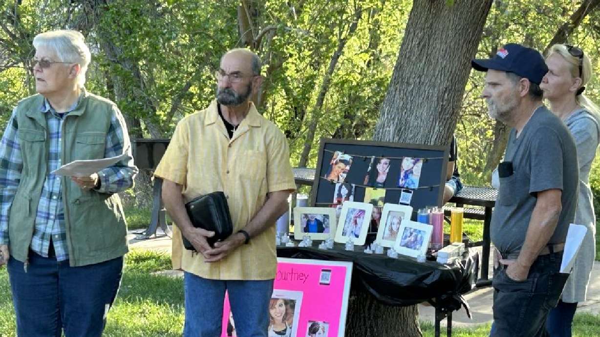 Chris and Vince Valence attend a candlelight vigil for Courtney Lynne Townsend at Nisson Park, in Washington City on Saturday. It has been five months since Courtney Lynne Townsend disappeared.