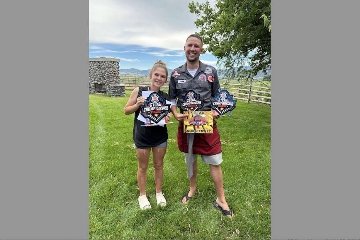 MacKenna York and her father Jeremy Mecham celebrate after competing at a grilling competition.