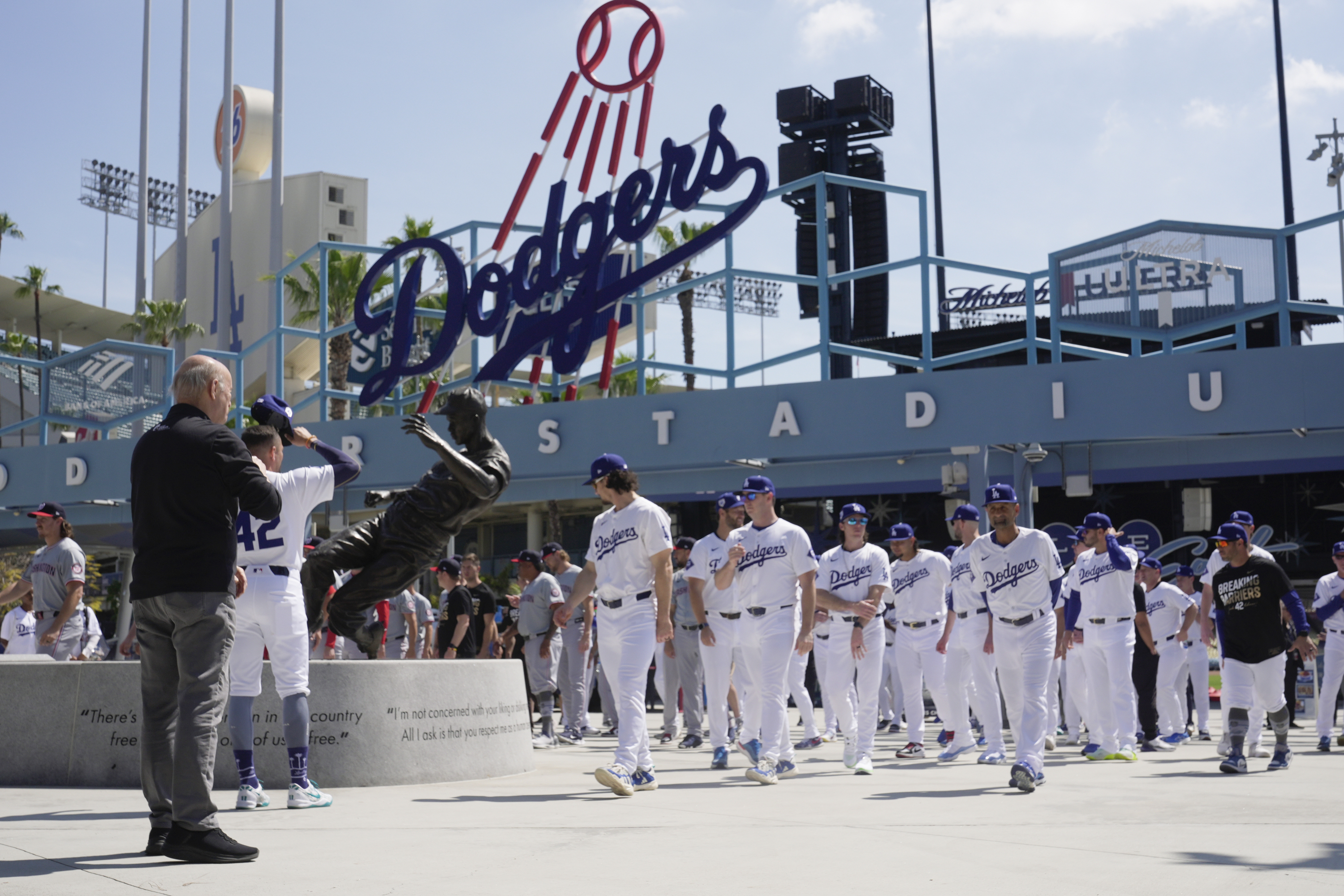 Los Angeles Dodgers and Washington Nationals team members arrive to celebrate Jackie Robinson Tribute Day before a baseball game at Dodgers Stadium in Los Angeles on Monday, April 15, 2024. 