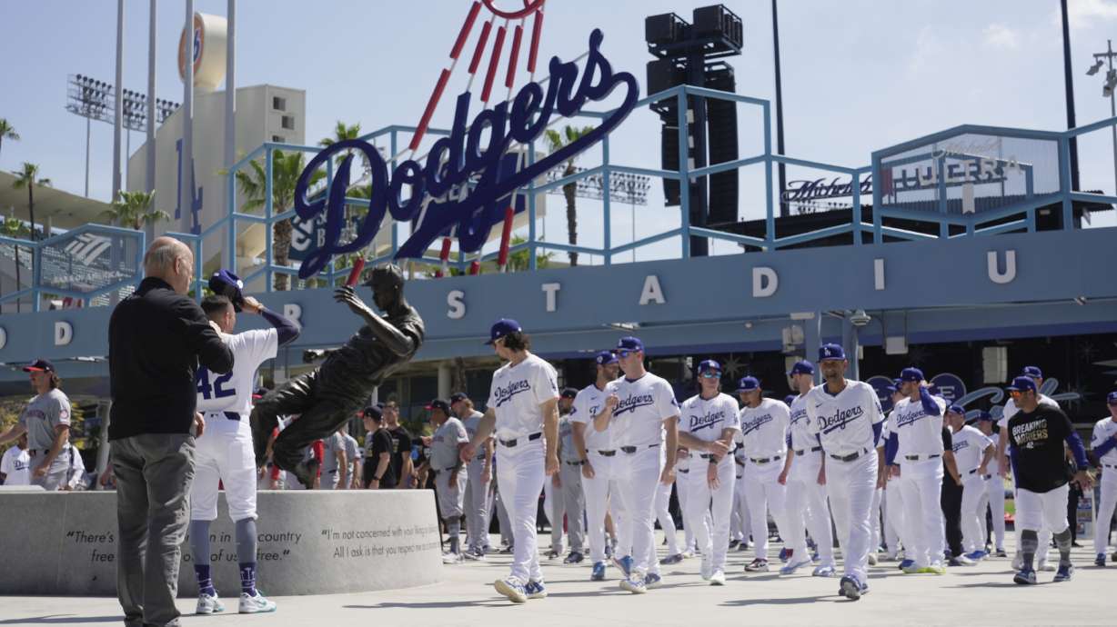 Los Angeles Dodgers and Washington Nationals team members arrive to celebrate Jackie Robinson Tribute Day before a baseball game at Dodgers Stadium in Los Angeles on Monday, April 15, 2024.