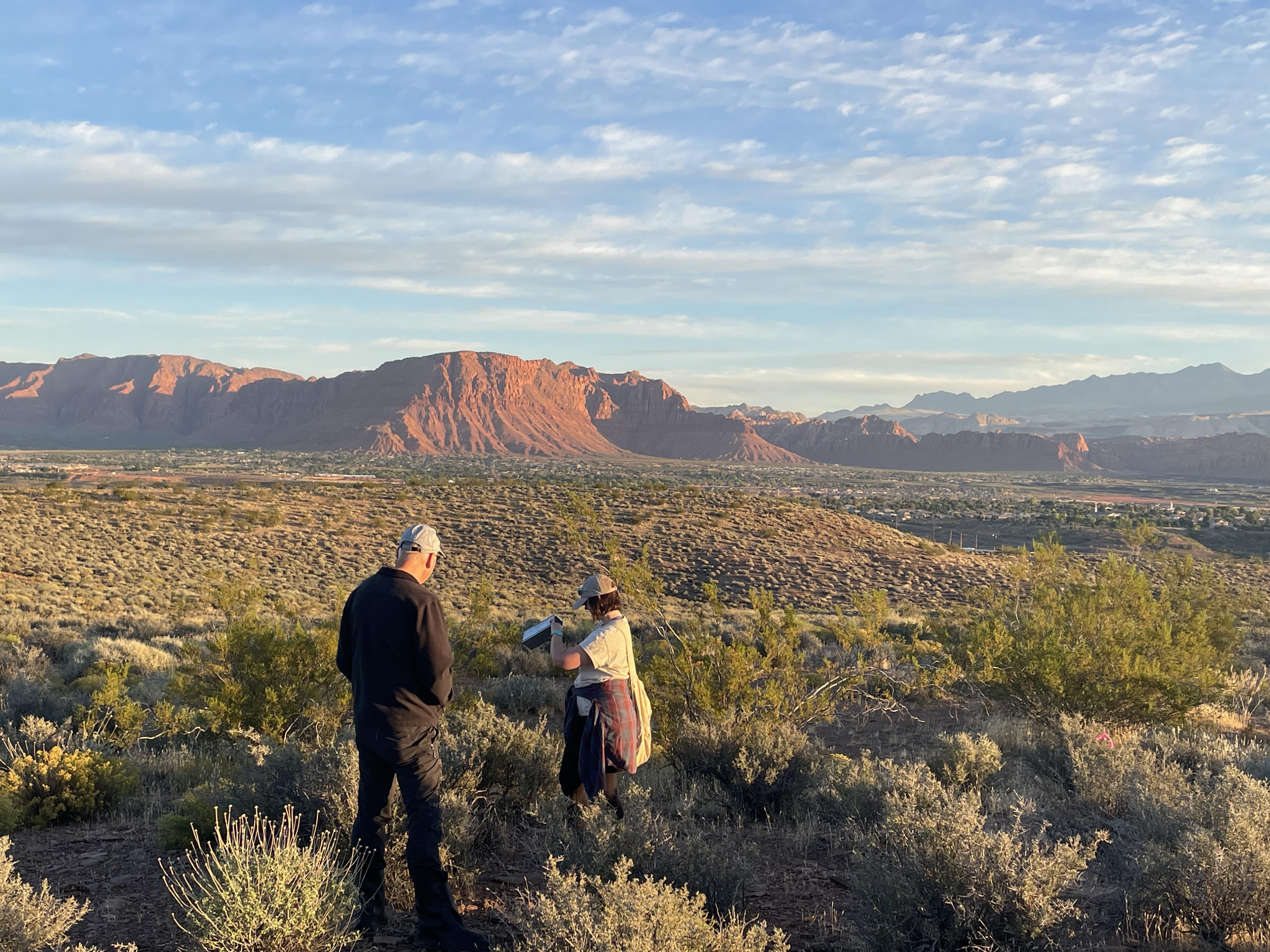 Researchers Kevin Perry and Katrina Derieg check for samples of fungus outside Santa Clara.