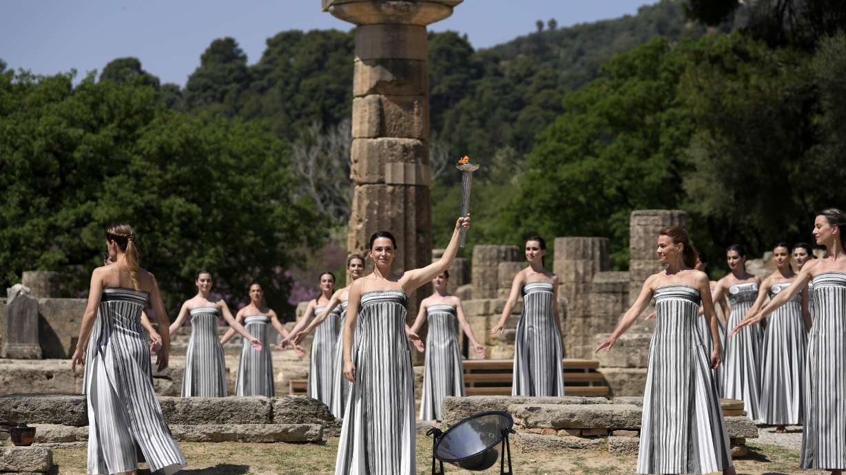 Performers take part in the final dress rehearsal of the flame lighting ceremony for the Paris Olympics, at the Ancient Olympia site, Greece, Monday. The flame for the Paris Olympics will be officially lit Tuesday at the birthplace of the ancient games, and will then be carried through Greece for 11 days before being handed over to Paris organizers on April 26.