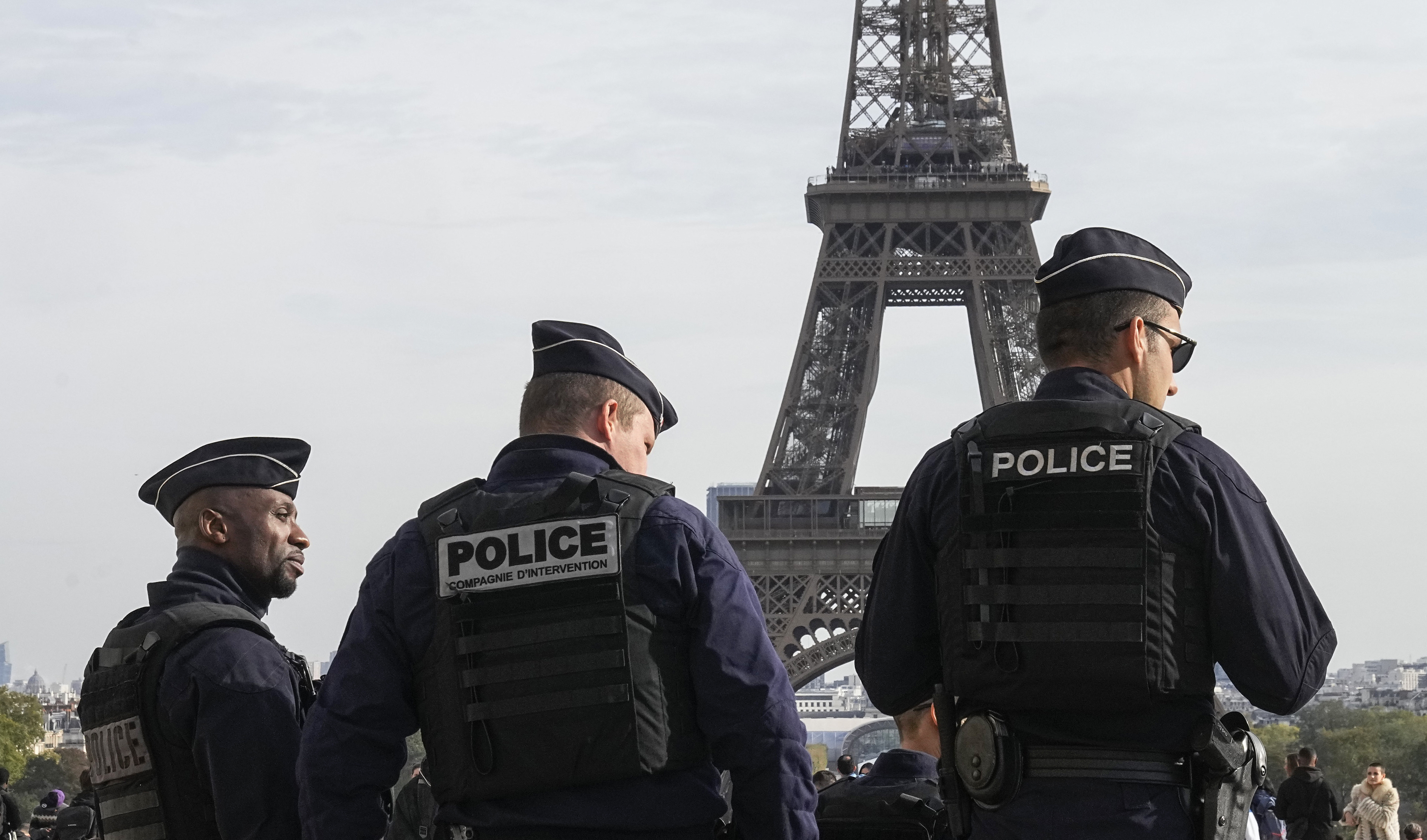 FILE - Police officers patrol the Trocadero plaza near the Eiffel Tower in Paris, Tuesday, Oct. 17, 2023. France says it has asked 46 countries if they can supply more than 2,000 police officers to help secure the Paris Olympics. Organizers are finalizing security planning for the July 26-Aug. 11 Games, the French capital’s first in a century. 