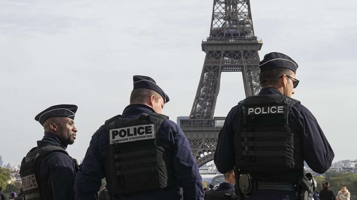 FILE - Police officers patrol the Trocadero plaza near the Eiffel Tower in Paris, Tuesday, Oct. 17, 2023. France says it has asked 46 countries if they can supply more than 2,000 police officers to help secure the Paris Olympics. Organizers are finalizing security planning for the July 26-Aug. 11 Games, the French capital’s first in a century.