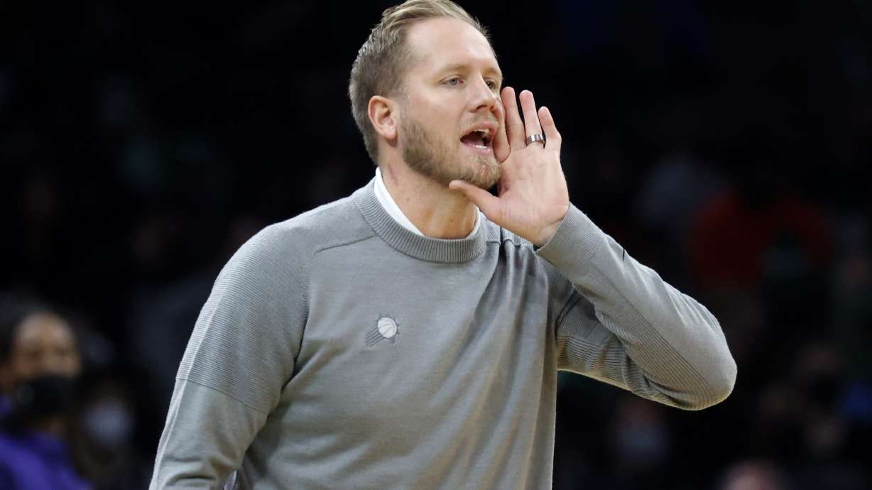 Phoenix Suns acting head coach Kevin Young yells to his team during the first half of an NBA basketball game against the Boston Celtics, Friday, Dec. 31, 2021, in Boston.