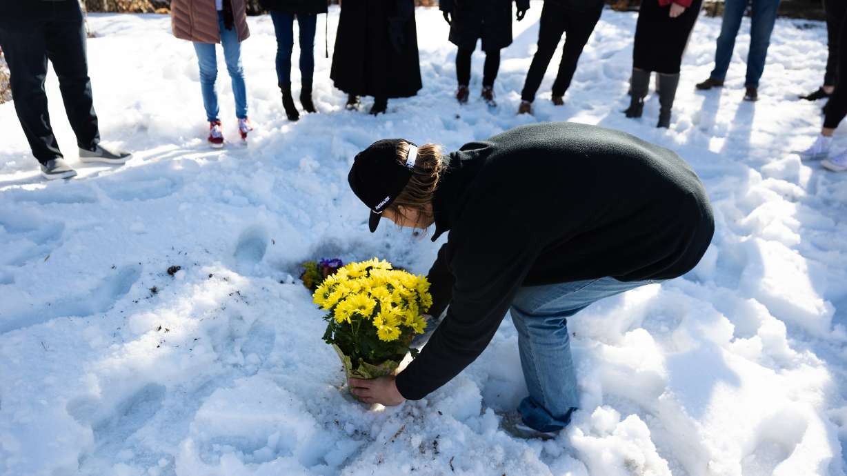 A bouquet of yellow daisies, Jordan Rasmussen’s favorite flower, is placed at his grave at Wasatch Lawn Memorial Park and Mortuary in Millcreek on March 5, 2023.
