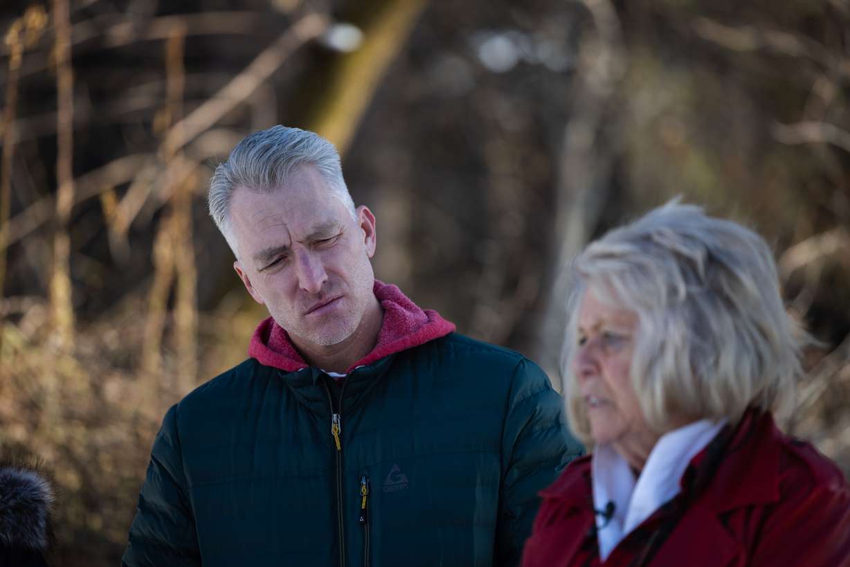 Chad Rasmussen, son of Jordan Rasmussen, listens as his aunt, Leslie Moore, remembers his father at Wasatch Lawn Memorial Park and Mortuary in Millcreek on March 5, 2023.
