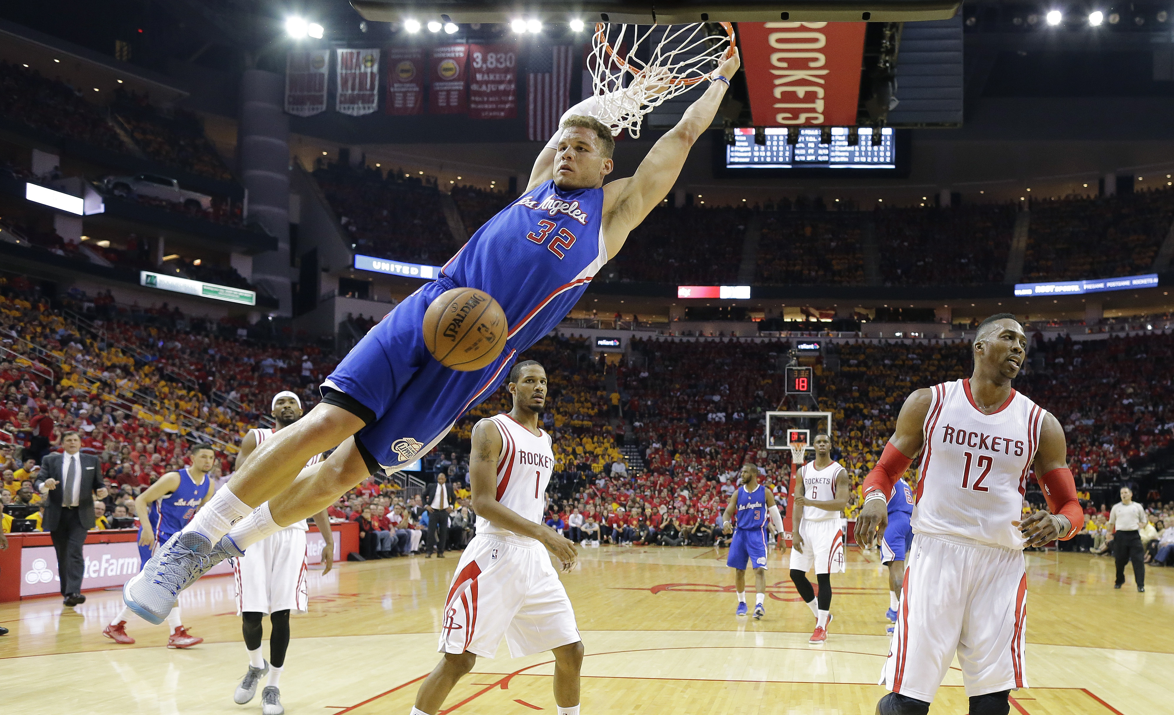 FILE - Los Angeles Clippers' Blake Griffin (32) scores past Houston Rockets' Dwight Howard (12) and Trevor Ariza (1) during the second half in Game 5 of the NBA basketball Western Conference semifinals Tuesday, May 12, 2015, in Houston. Griffin announced his retirement Tuesday, April 16, 2024, after a 14-year career that included six All-Star selections, Rookie of the Year honors and a dunk contest victory.