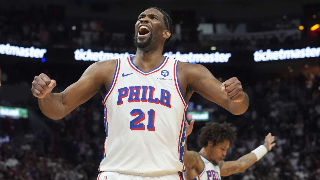 Philadelphia 76ers center Joel Embiid (21) celebrates as the team pulls ahead of the Miami Heat during the last minute of the second half of an NBA basketball game, Thursday, April 4, 2024, in Miami. The 76ers defeated the Heat 109-105.