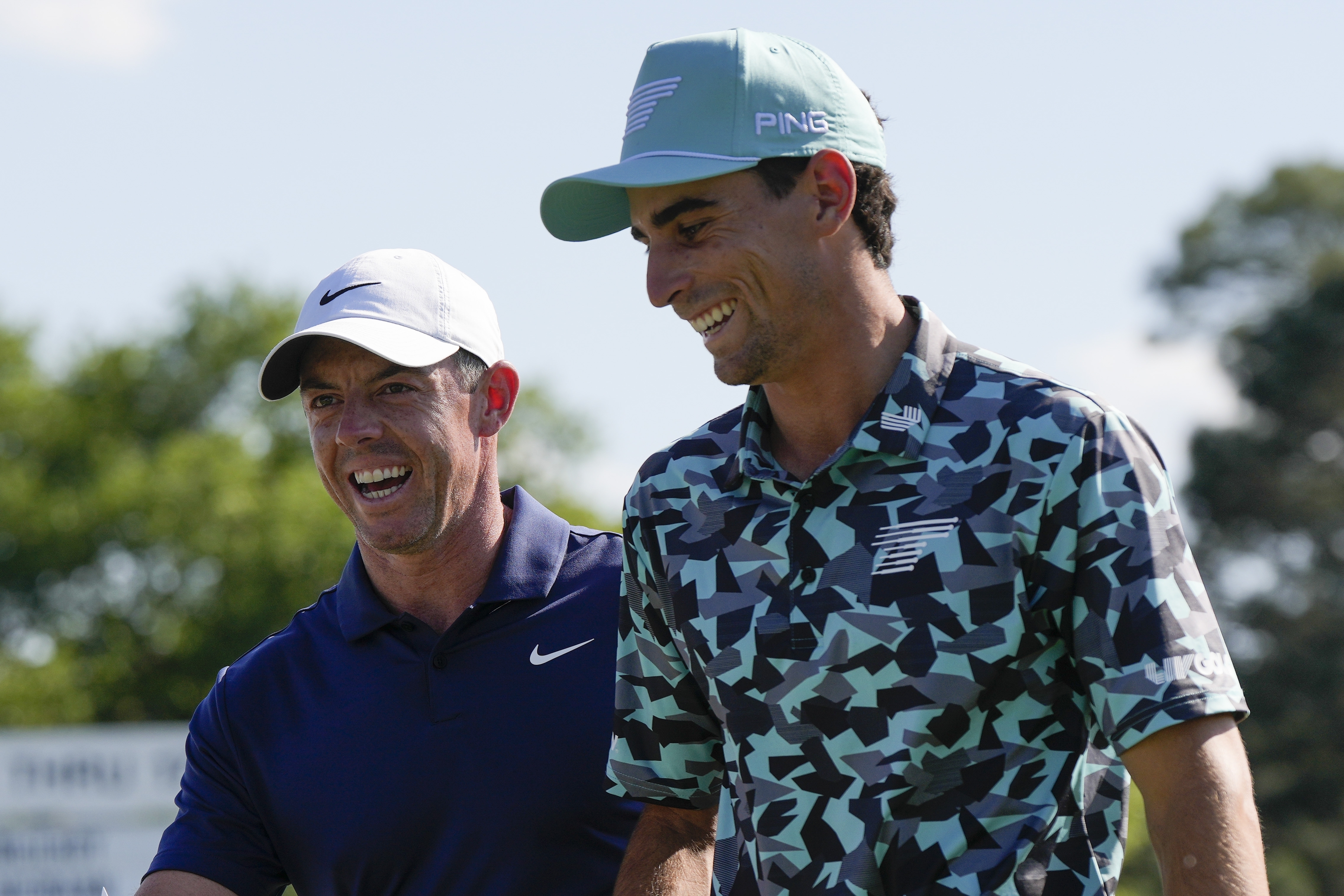 Rory McIlroy, left, of Northern Ireland, and Joaquin Niemann, of Chile, walks off the 18th hole after final round at the Masters golf tournament at Augusta National Golf Club Sunday, April 14, 2024, in Augusta, Ga.