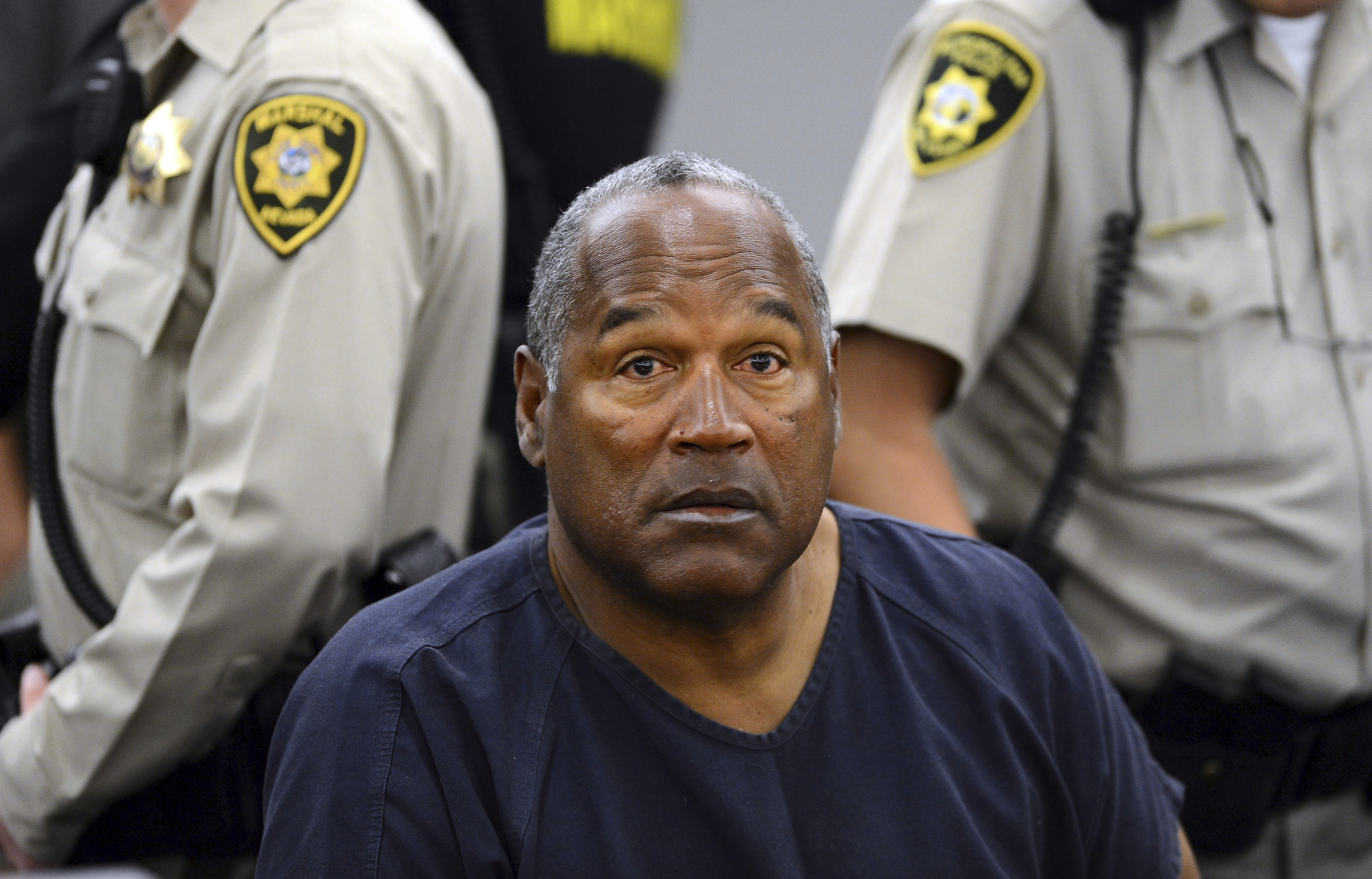 FILE - In this May 14, 2013, file photo, O.J. Simpson sits during a break on the second day of an evidentiary hearing in Clark County District Court in Las Vegas. O.J. Simpson's attorney Malcolm LaVergne is now handling the deceased former football star, actor and famous murder defendant's financial estate. 