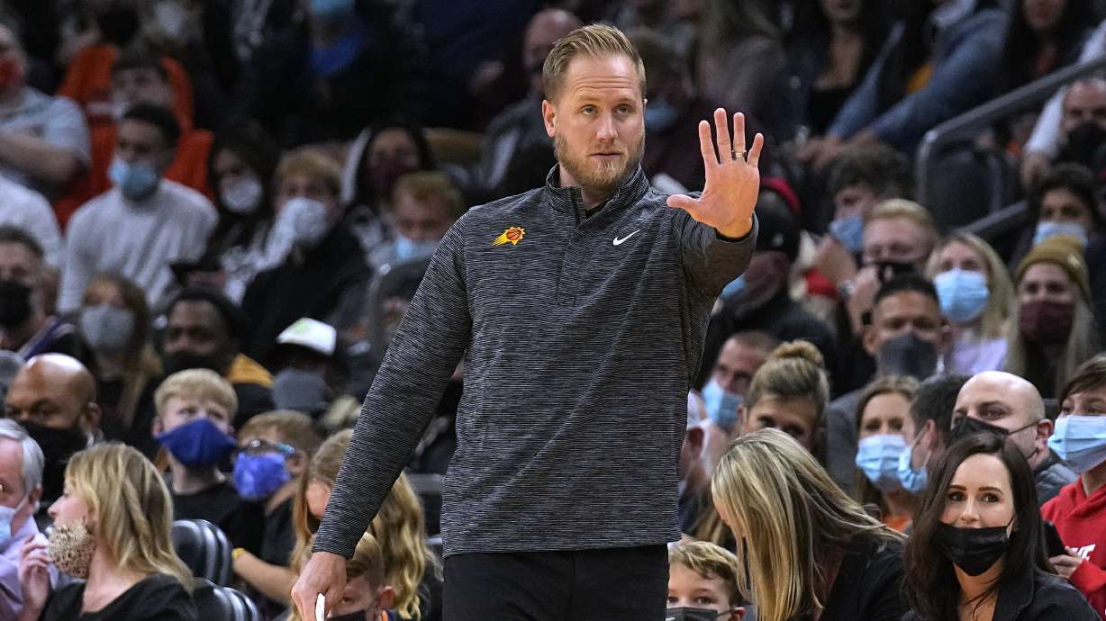 Phoenix Suns acting coach Kevin Young, who was filling in while Monty Williams was in COVID-19 protocols, calls out a play during the first half of an NBA basketball game against the Memphis Grizzlies, Monday, Dec. 27, 2021, in Phoenix.
