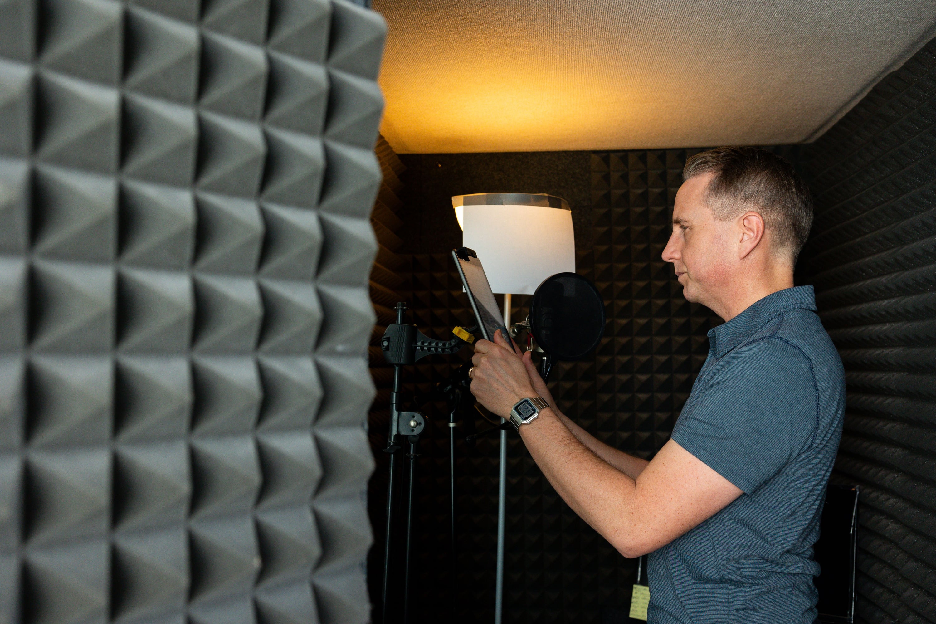 Kirby Heyborne mocks his audio recording setup for a portrait in his home in American Fork on Friday.