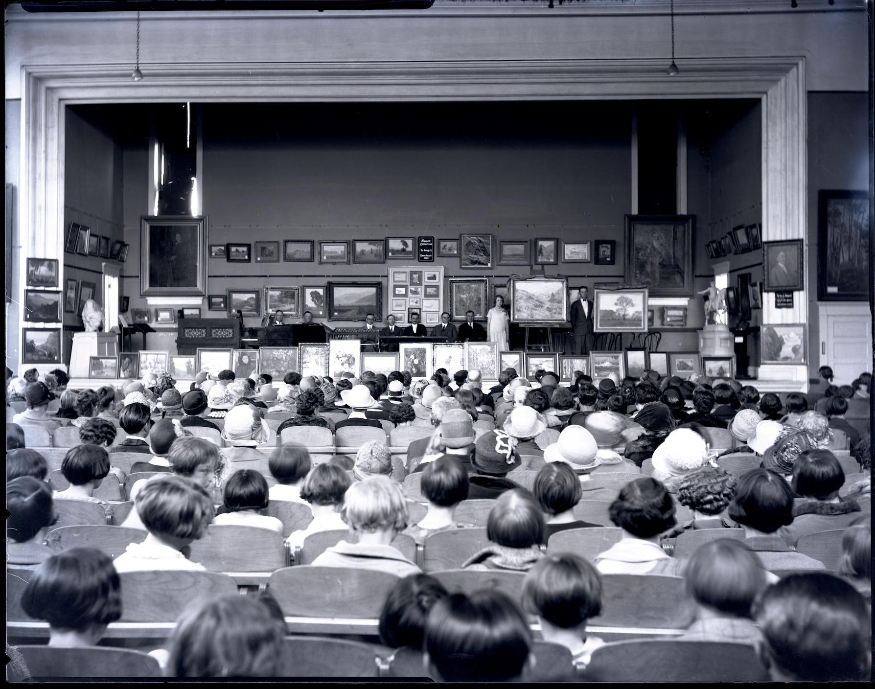 Students attend the unveiling ceremony for artwork in the 1925 Spring Salon for the Springville Museum of Art.