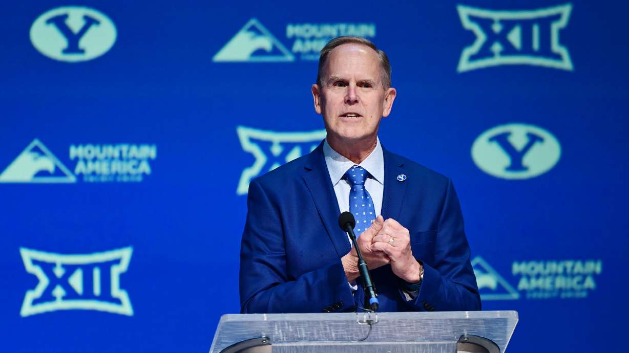 BYU’s director of athletics Tom Holmoe introduces the school’s new men’s head basketball coach Kevin Young at an announcement event in the Marriott Center in Provo on Wednesday, April 17, 2024.