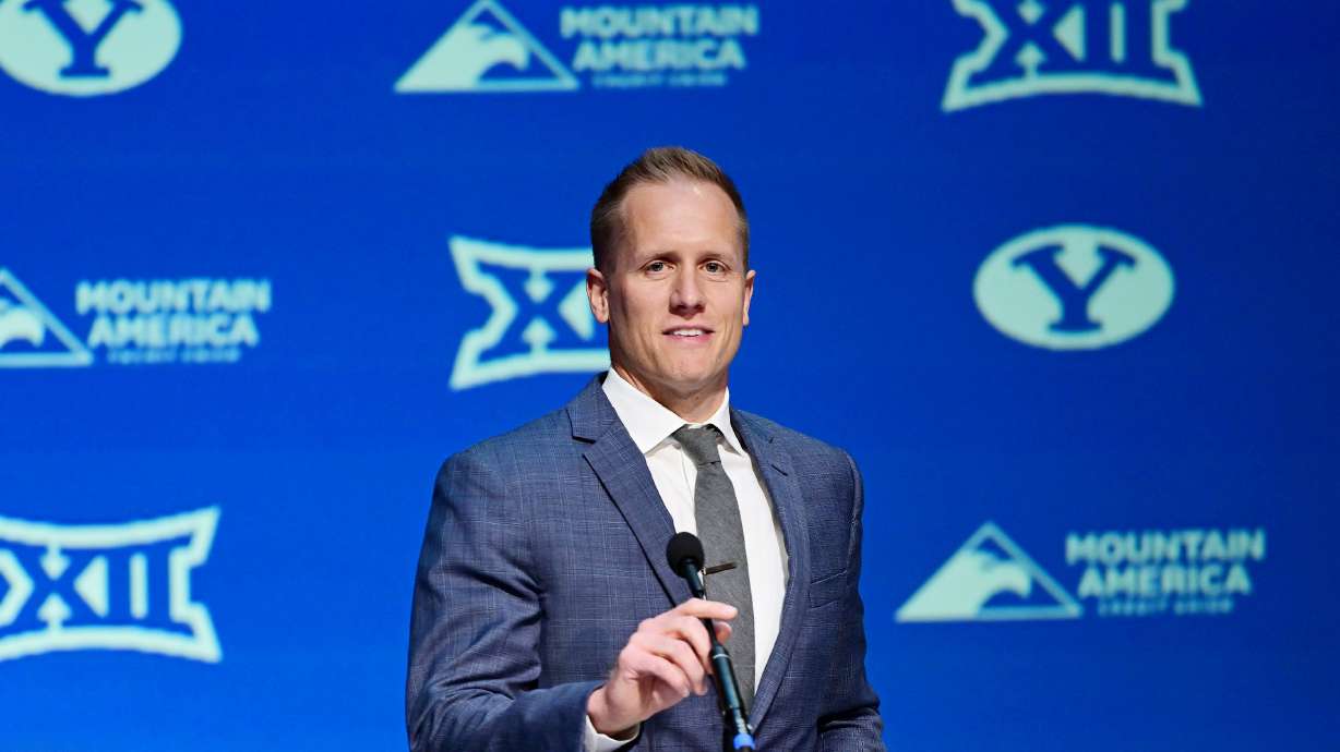BYU’s new men’s head basketball coach Kevin Young steps to the microphone during an announcement event in the Marriott Center in Provo on Wednesday, April 17, 2024.