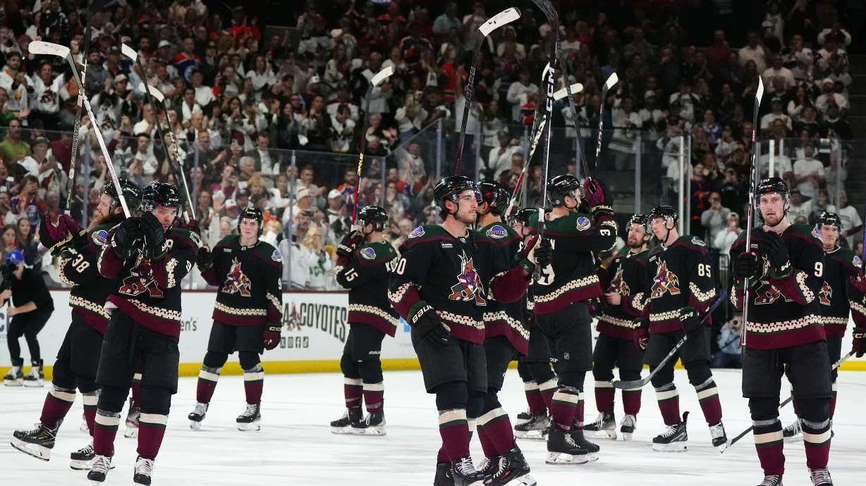 Arizona Coyotes players acknowledge the fans after an NHL hockey game against the Edmonton Oilers on Wednesday, April 17, 2024, in Tempe, Ariz. The Coyotes won 5-2. Team owner Alex Meruelo agreed to sell franchise's hockey operations to Utah Jazz owner Ryan Smith, who intends to move the team to Salt Lake City.