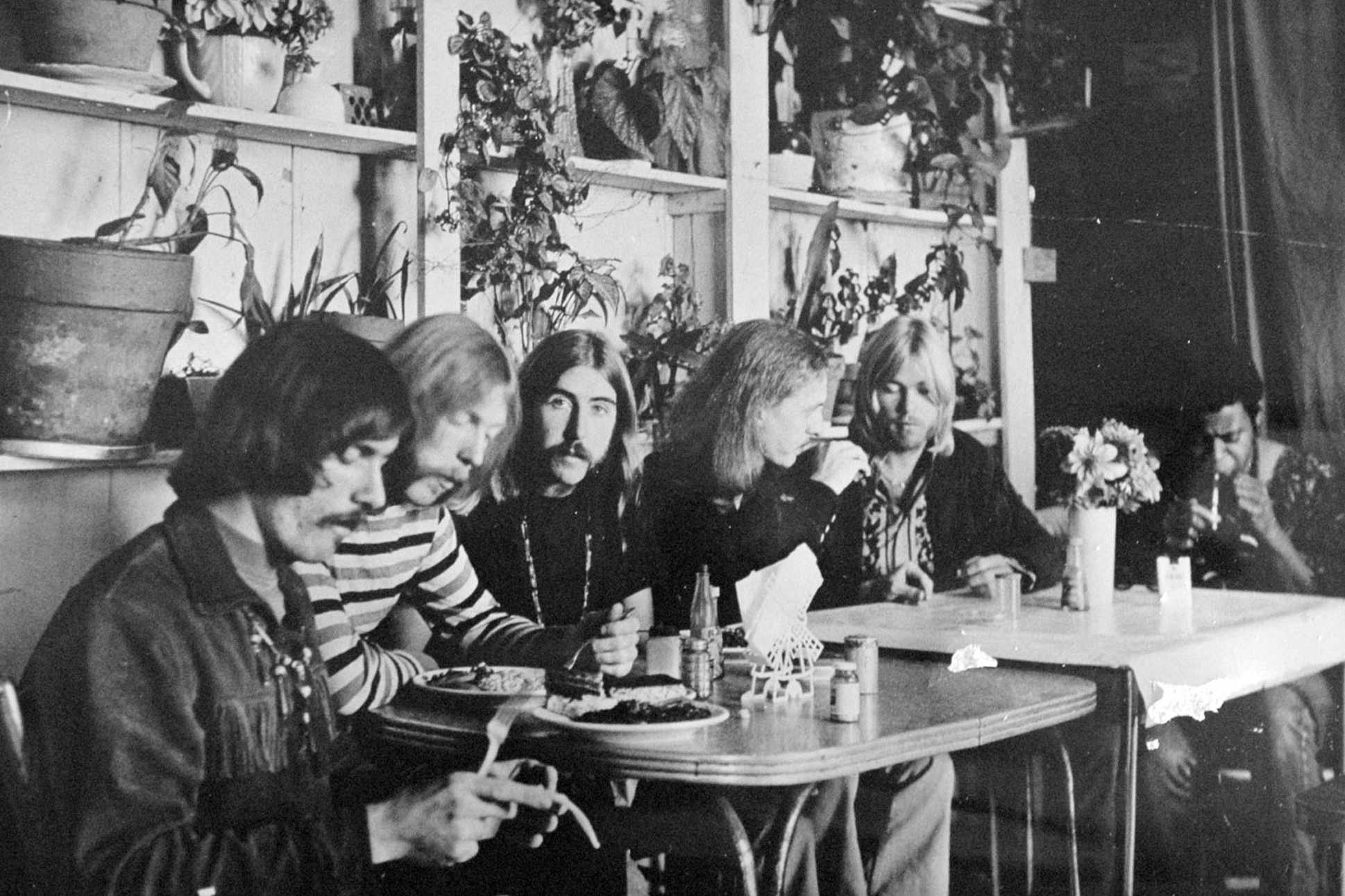 This undated photo shows members of the Allman Brothers Band, from left, Dickey Betts, Duane Allman, Berry Oakley, Butch Trucks, Gregg Allman and Jai Johanny "Jaimoe" Johanson, eating at the H&H Restaurant in downtown Macon, Ga. Guitar legend Betts, who co-founded the Allman Brothers Band and wrote their biggest hit, “Ramblin’ Man,” died Thursday. He was 80.