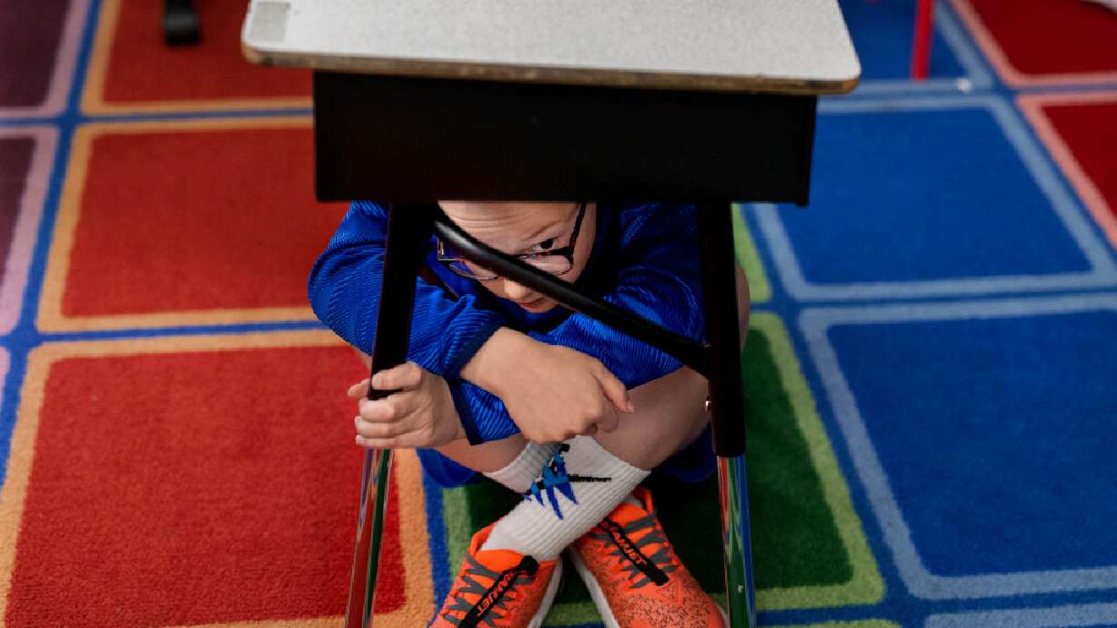 Third-grader Burke Neese participates in the Great Utah ShakeOut earthquake drill at Canyon View Elementary School in Cottonwood Heights on Thursday.