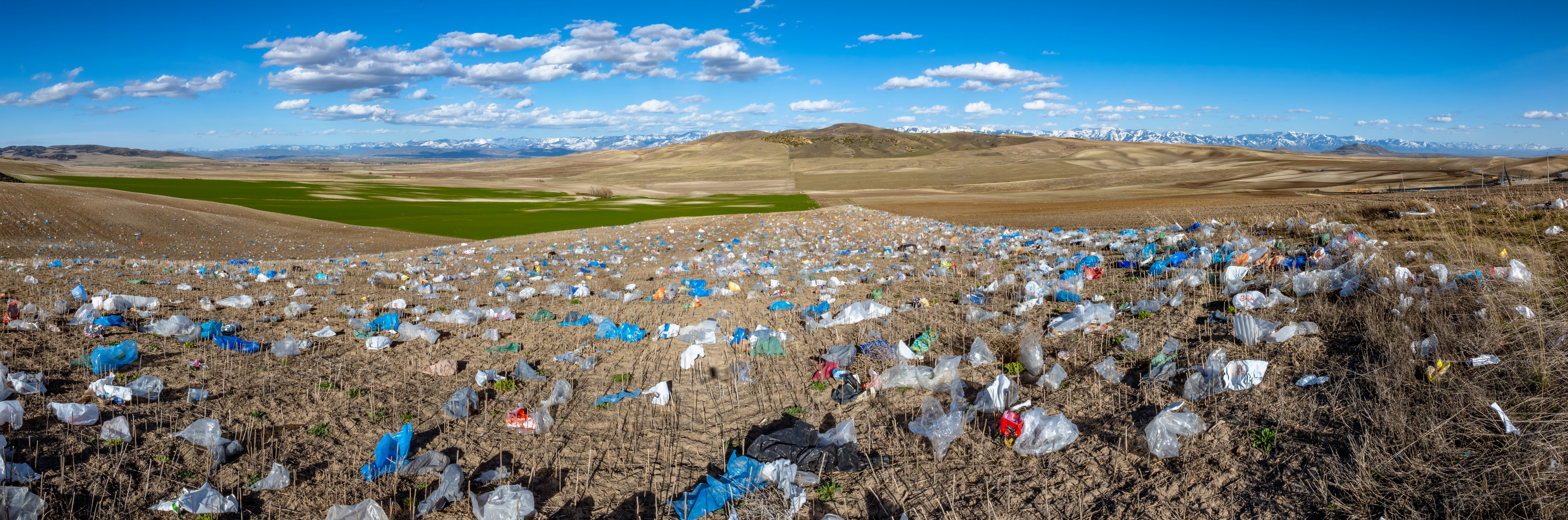 Plastic debris from the North Valley Landfill in Cache County covers the fields of farmers near the site on Monday.