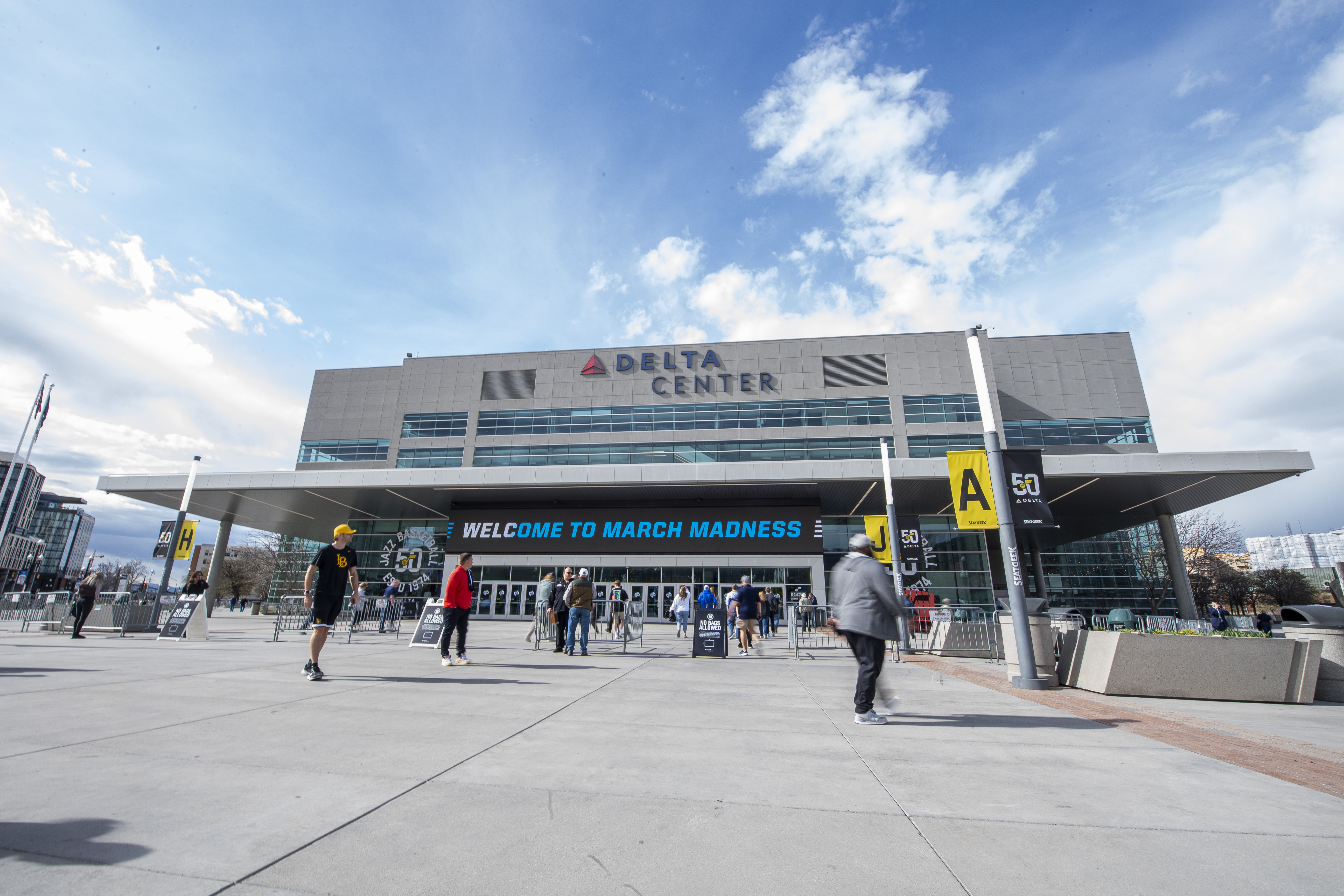 Fans make their way into the Delta Center before a first-round college basketball game between Long Beach State and Arizona in the NCAA Tournament in Salt Lake City, Thursday, March 21, 2024.