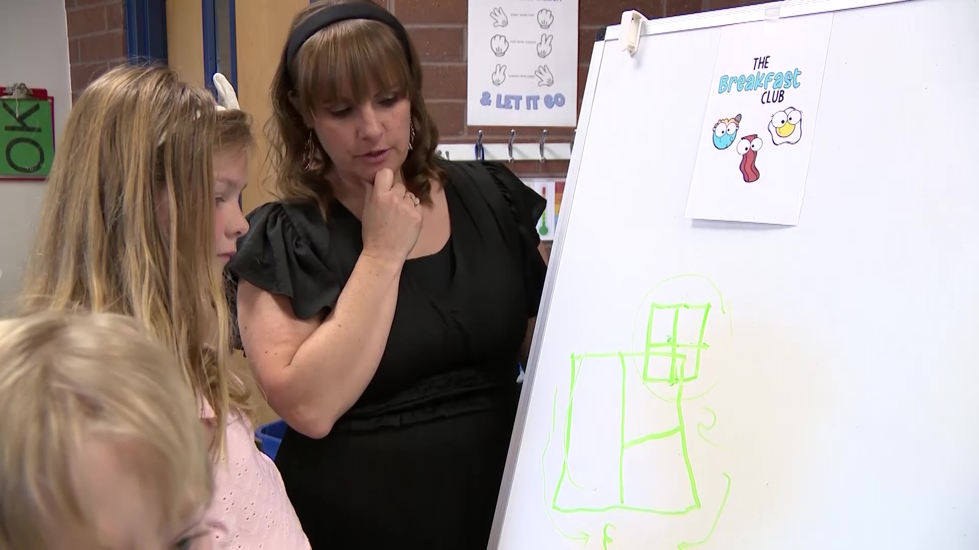 The students work on whiteboards to write down their mistakes, erase them quickly, and move on to another solution.