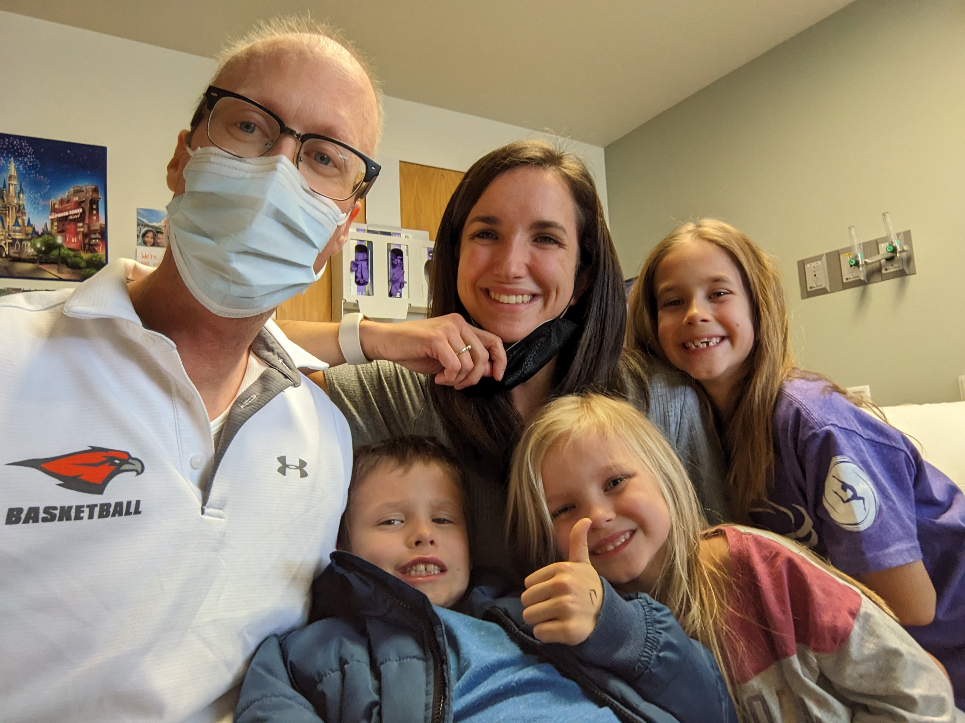 Marc Dunbabin with his wife and three young kids at the hospital.